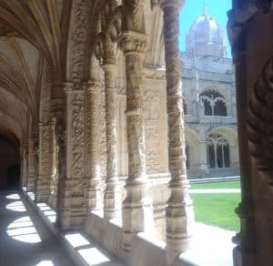 Manueline cloister at Jerónimos Monastery with elaborate stone carvings inspired by the Portuguese Discoveries.